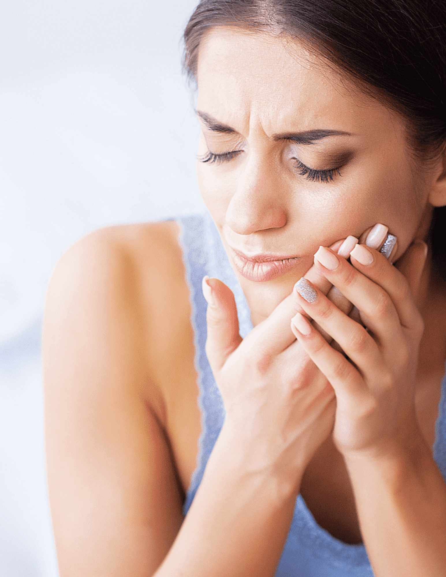 Woman with a toothache looking for Tooth Extractions performed by our dentists in Brentwood, TN